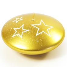 Biele hviezdy na zlatej sviečke