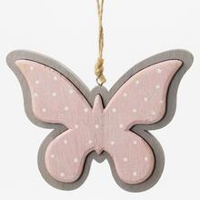 Závesný motýľ v ružovej farbe s bodkami.