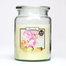 Aromatická sviečka v sklenenom obale s kvetinovým dizajnom.