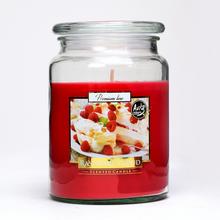 Aromatická sviečka s malinovou vôňou v sklenenom obale.