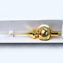 Zlatý sklenený špic na vianočný stromček.