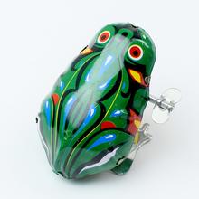 Naťahovacia žaba z kovu s farebným dizajnom.