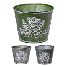 Kovový obal s kvetinovým vzorom v troch farbách.