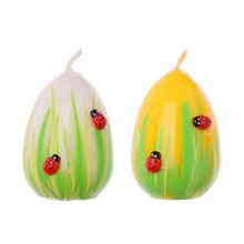 Malé veľkonočné sviečky vo forme vajec s lienkami.