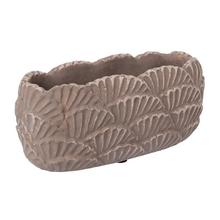 Cementový obal oválneho tvaru v hnedej farbe.