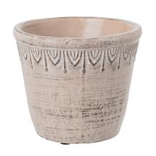 Cementový obal v svetlohnedej farbe s dekoratívnym vzorom.