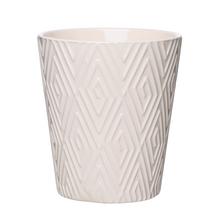 Obal na orchideu v krémovej farbe s geometrickým vzorom.