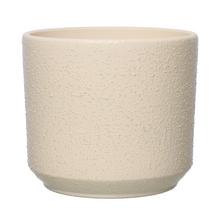 Obal na kvetináč v béžovej farbe s textúrovaným povrchom.