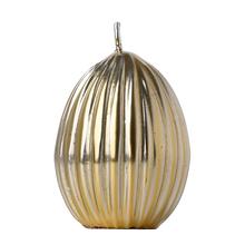 Malé vrúbkavané zlaté vajce sviečka.