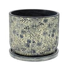 Kvetináč s kvetinovým vzorom v žltej a čiernej farbe.