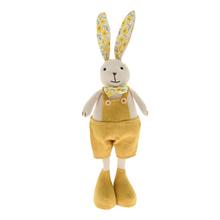 Žltý textilný zajačik s kvetinovými ušami.