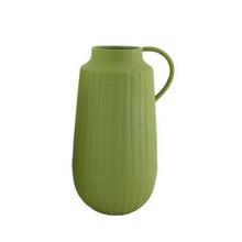 Kovová váza fľaša v zelenej farbe.