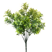 Umelé kvety so zeleno-žltými lístkami.