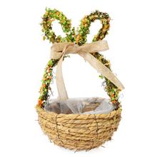 Obal košík vajce s dekoratívnymi ušami a stuhou.