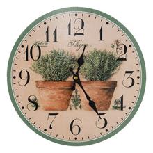 Nástenné hodiny s motívom byliniek, priemer 34 cm.