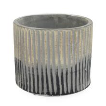 Kvetináč so zlatými a čiernymi prúžkami.