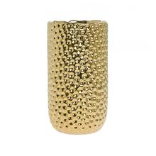 Zlatá keramická váza s textúrovaným povrchom.