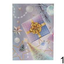 Darčeková taška s vianočným motívom a glitrami.