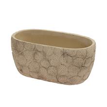 Obal na kvety z keramiky v béžovej farbe.