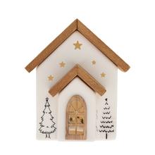 Biely a prírodný LED domček z porcelánu s vianočnými motívmi.