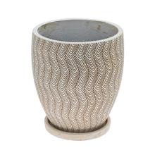 Béžový kvetináč s vlnkovým vzorom.