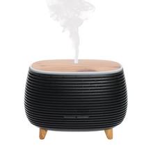 Difuzér na nožičkách v čiernej farbe s oválnym tvarom.