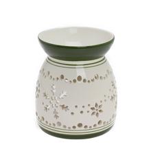 Aromalampa s bielym a zeleným vzorom vločiek.