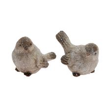 Keramické figúrky vtáčikov v bielej a zelenej farbe.