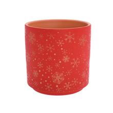 Červený obal s hviezdami na kvetináče.