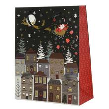 Vianočná papierová taška s motívom Santa Clausa a domčekov.