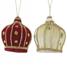 Závesná ozdoba v tvare korunky v červenej a bielej farbe.