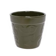 Zelený keramický obal s valčekom.