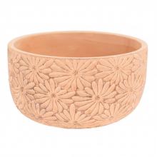 Žltý keramický obal s kvetinovým vzorom.