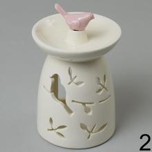 Aromalampa keramická s ružovým doplnkom v tvare vtáčika.