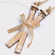 Drevené lyže na zavesenie s ozdobami