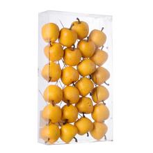 Žlté jabĺčka v boxe na dekoráciu.