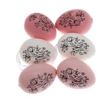 Sada plastových vajíčok s kvetinovým vzorom v ružovej, bielej a krémovej farbe.