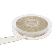 Biela stuha so zlatým lemom na rolke.