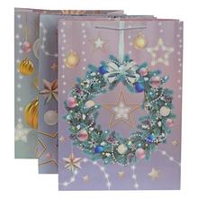 Darčeková taška s vianočným motívom a glitrami.