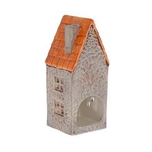 Porcelánový domček na sviečku s oranžovou strechou.