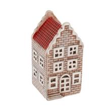 Porcelánový domček s červenou a zelenou strechou.