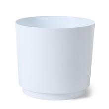 Biely okrúhly obal na kvety s moderným dizajnom.