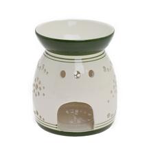 Aromalampa s bielym a zeleným vzorom vločiek.