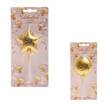 Zlatá tortová sviečka v tvare hviezdy.