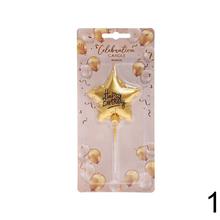 Zlatá tortová sviečka v tvare hviezdy.