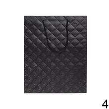 Darčeková taška v červenej farbe s vrkočom.