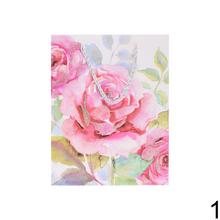 Darčeková taška s kvetinovým vzorom a glitrami.