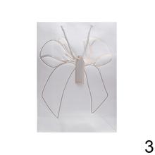 Darčeková taška s mašľou v rôznych farbách.