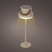 Solárne stolové svetlo v krémovej a bielej farbe.