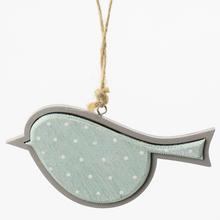 Závesný vtáčik s bodkami v modrej farbe.